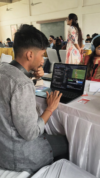 Student developing software at a hackathon